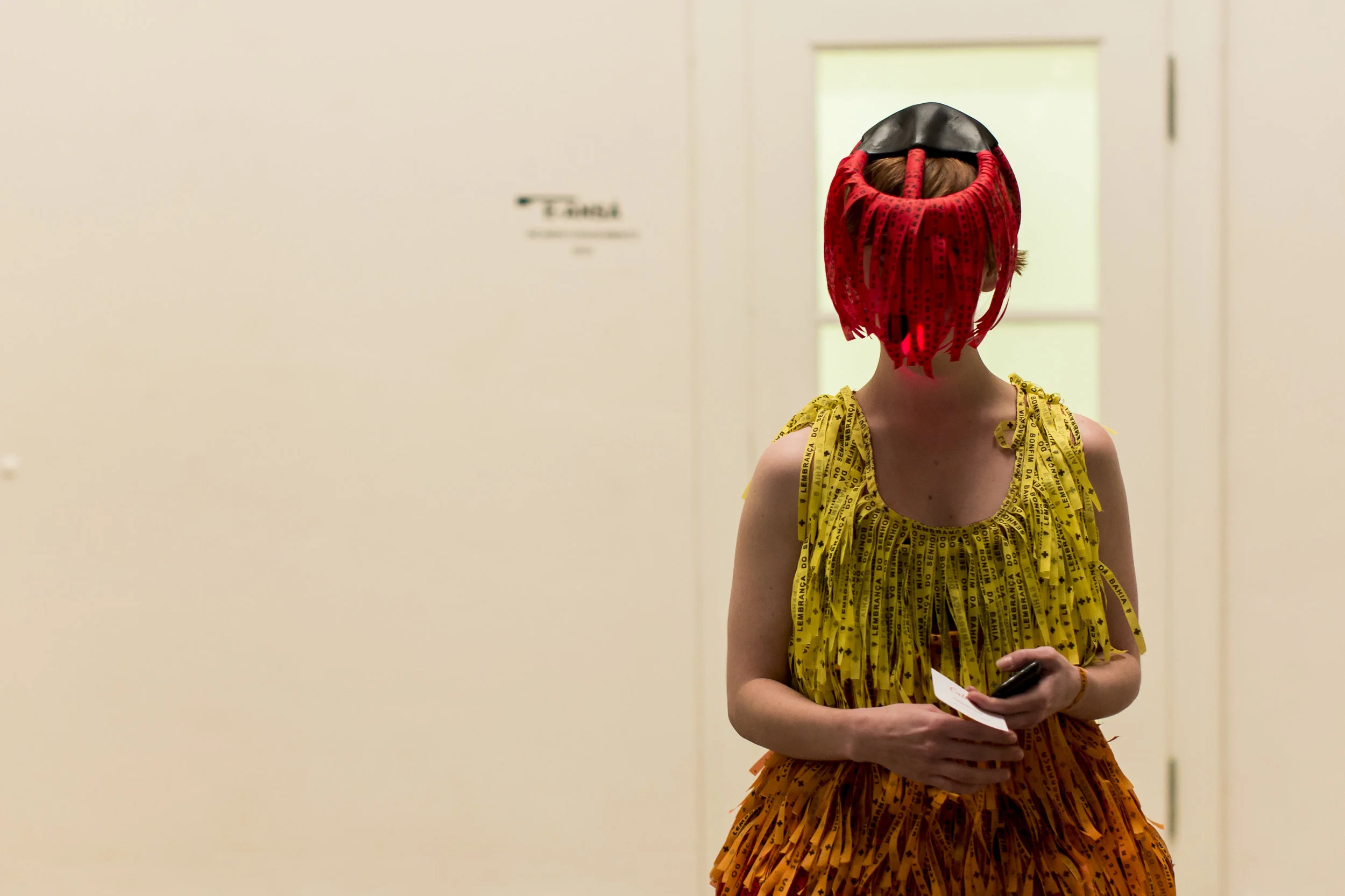 The performer wearing e-Ansã in a gallery setting