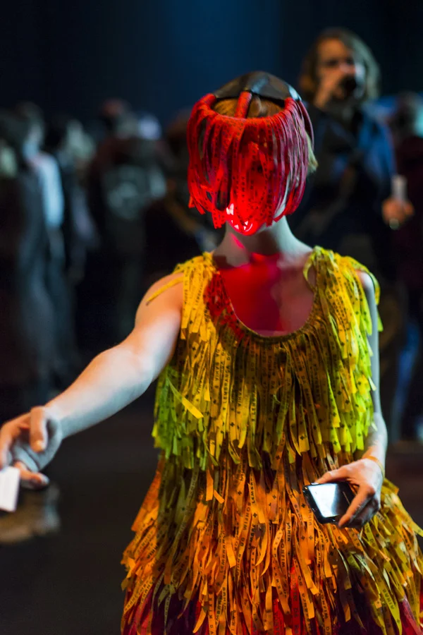 Front view of a performer wearing the ribbon-covered e-Ansã dress