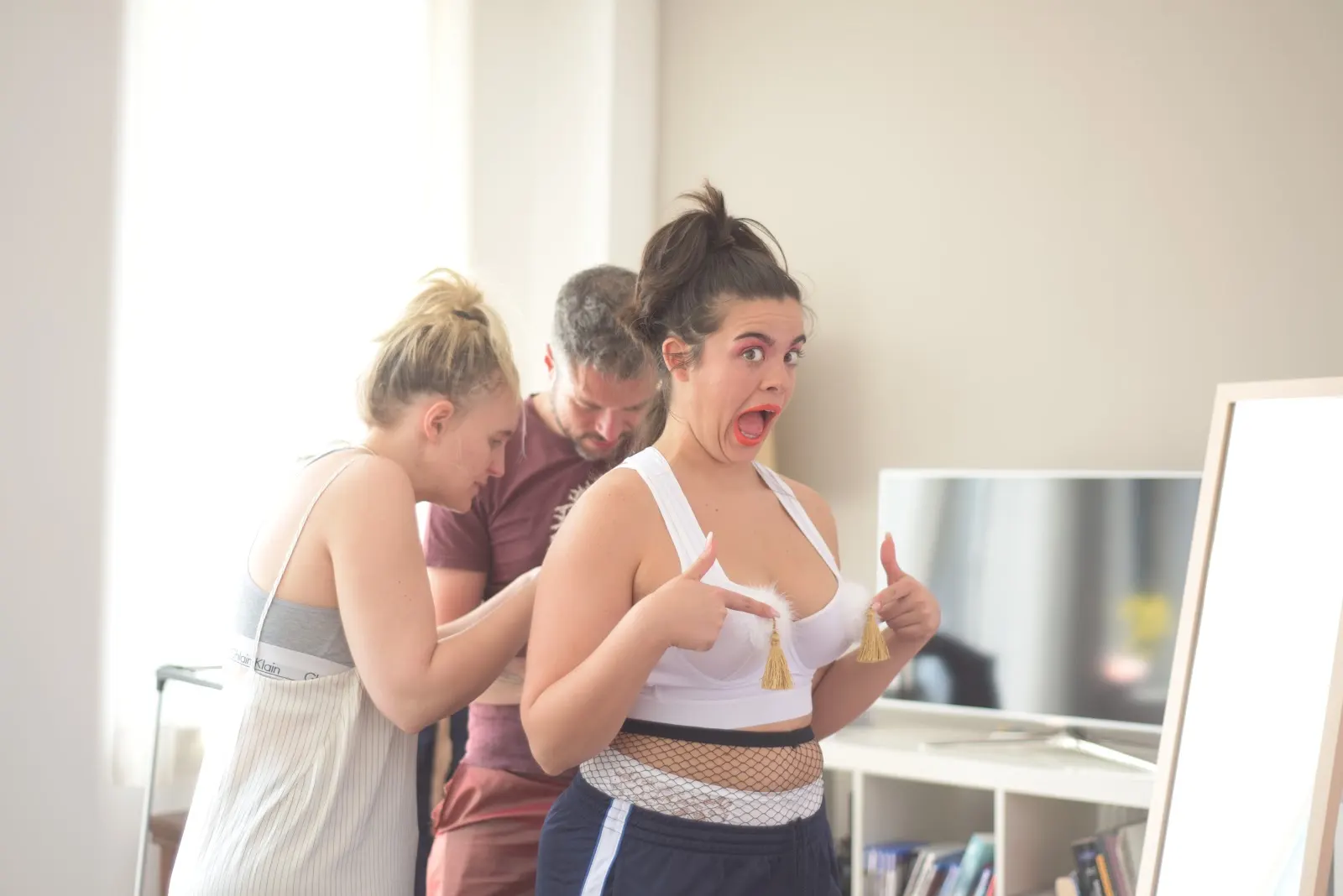 The performer testing the Lazy Burlesque Bra during a fitting with the project team