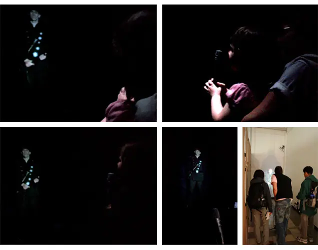 Visitor speaking into a microphone while facing the police officer projection