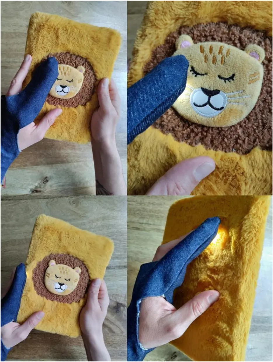 A denim haptic glove sensing the colours and textures of a yellow fabric object.