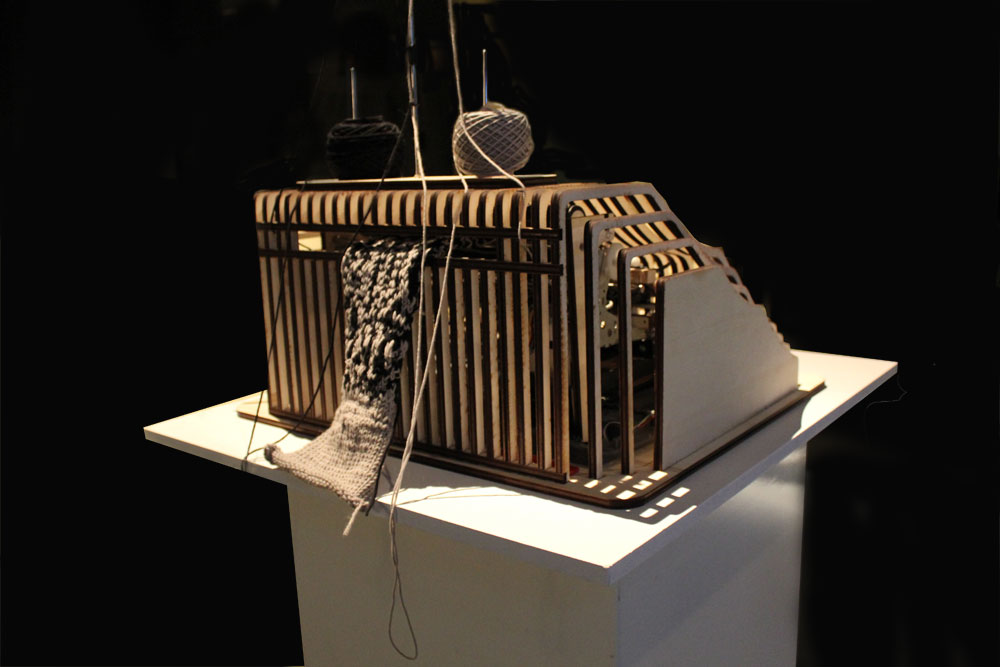 Rear view of TK 730 producing a two-colour knitted strip